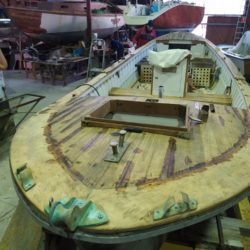 Repair and varnish jobs on typical wooden vessel of the North of Spain